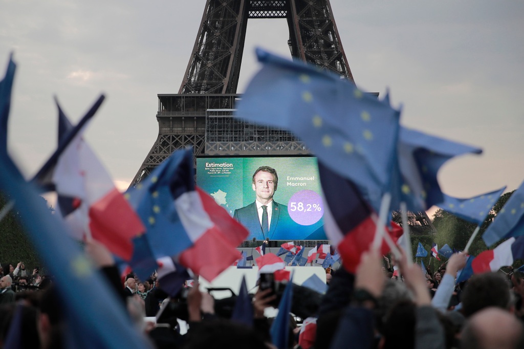 French celebrate reports of Macron's win in Paris on April 24, 2022.